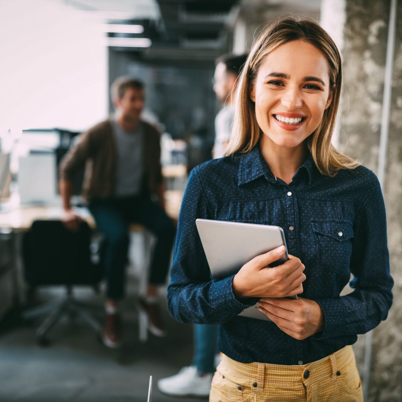 Lady Smiling with Tablet